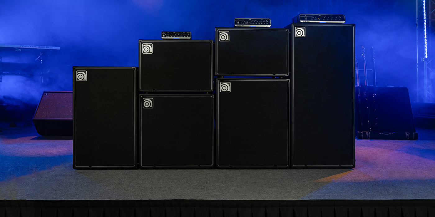 Venture V3, V7, and V12 bass amps with VB-88, VB-112, VB-115, VB-210, VB-212, and VB-410 cabs on stage.