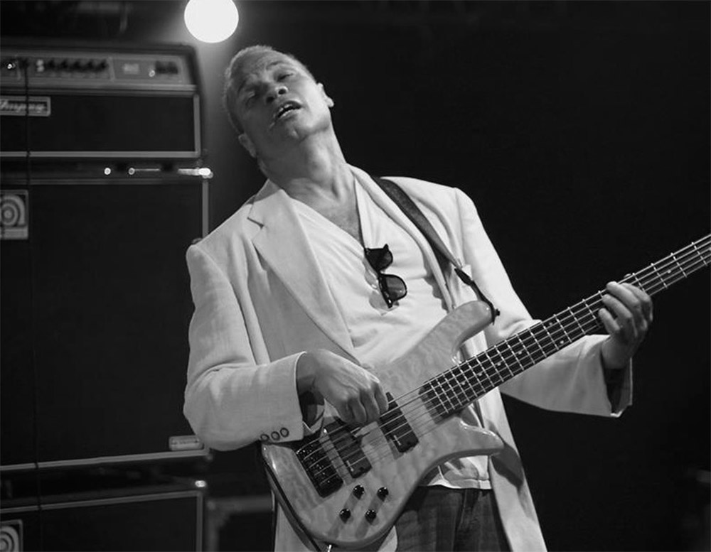 Lenny Bradford playing bass on stage