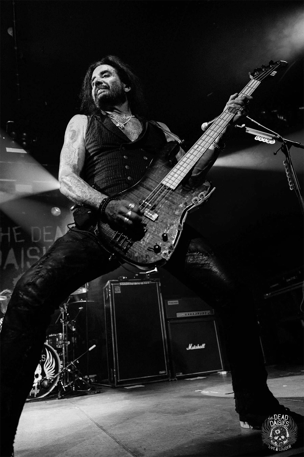 Marco Mendoza playing bass on stage