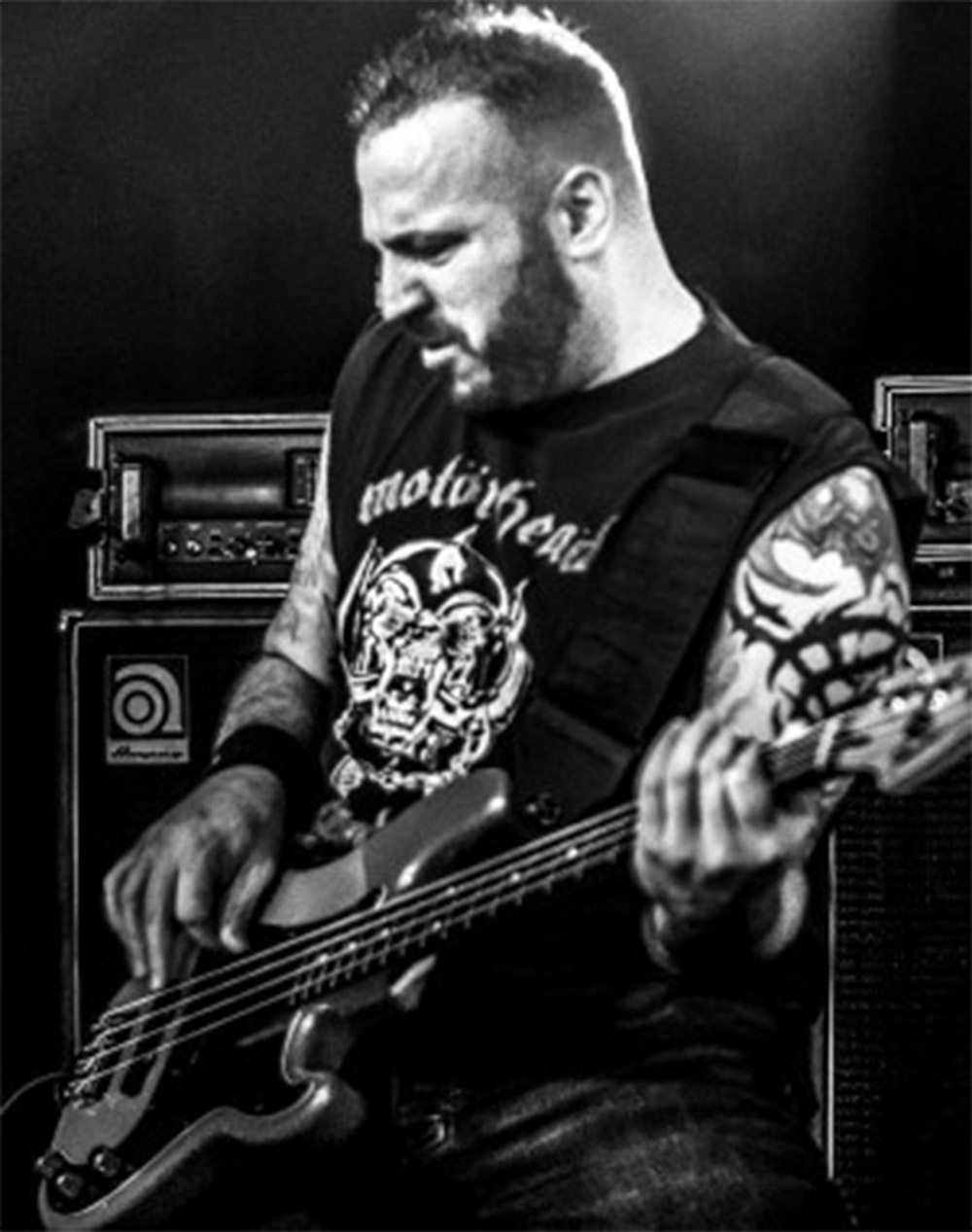Mark Menghi playing bass on stage