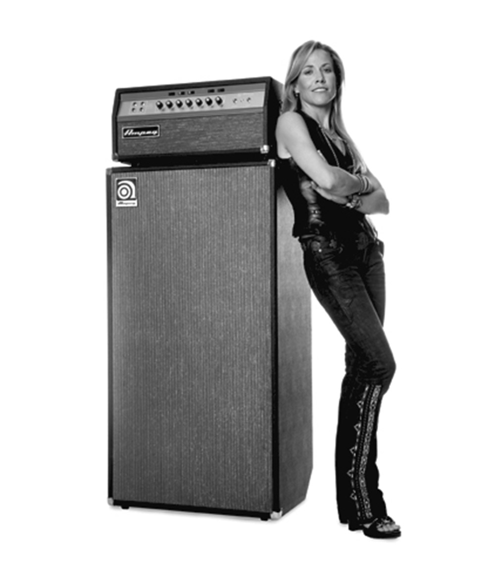 Sheryl Crow leaning against a SVT VR stack
