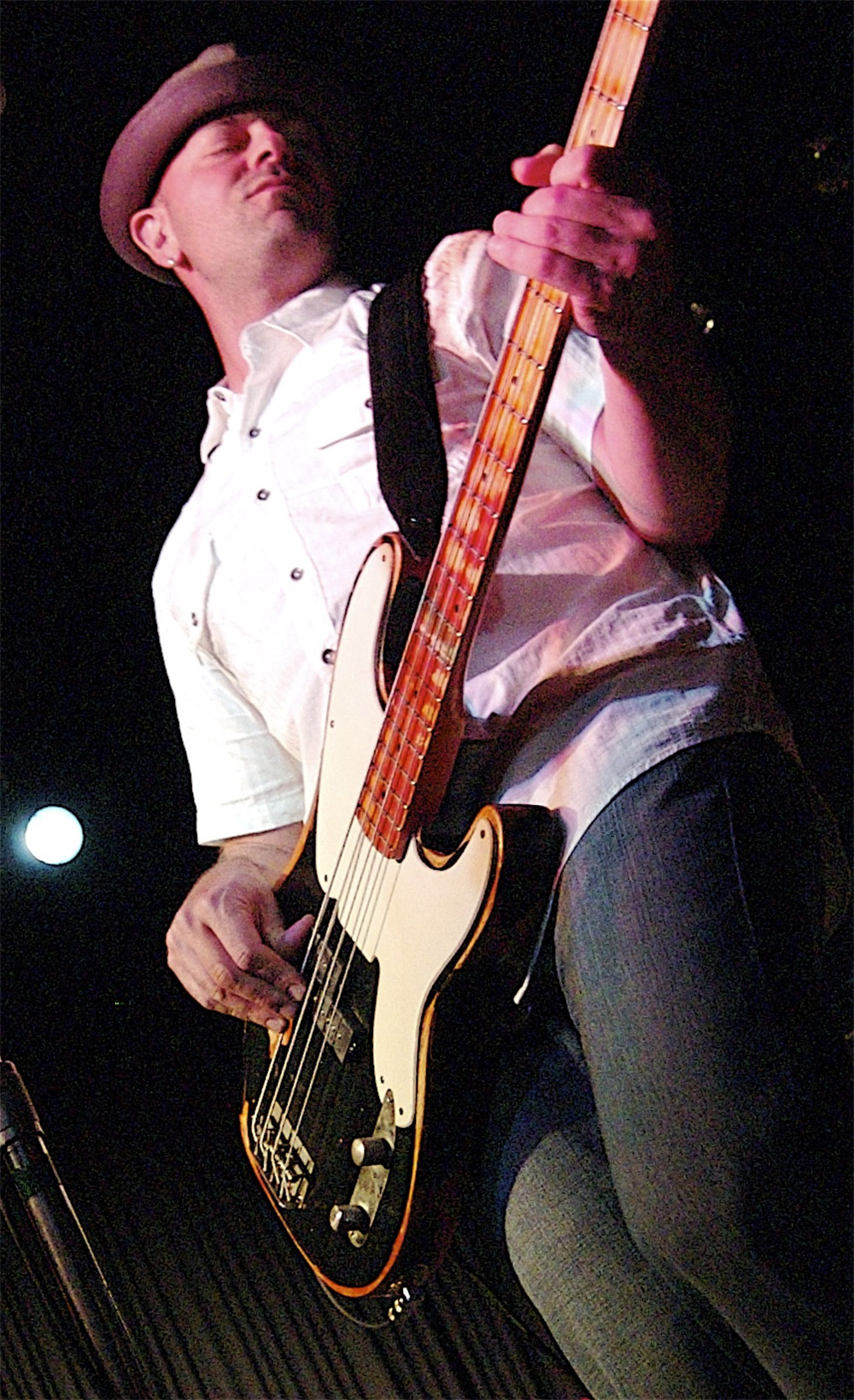 Steve Cook playing bass on stage