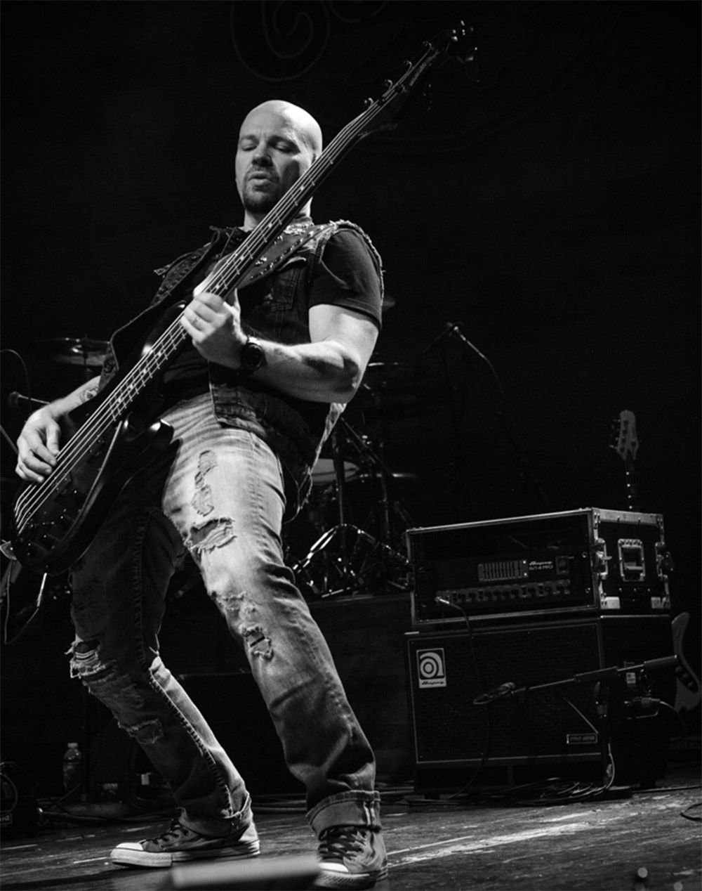 Tracy Goode playing bass on stage