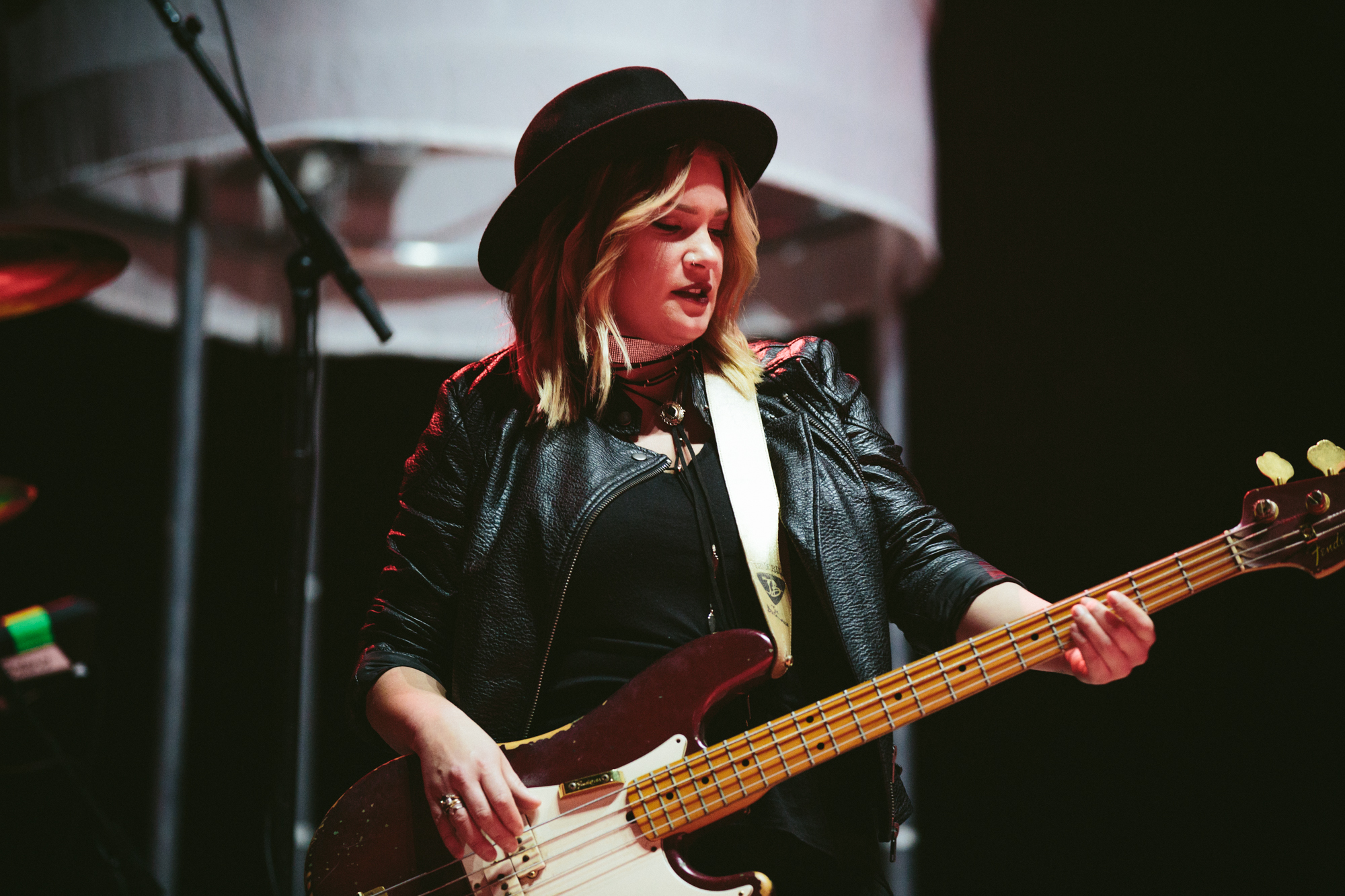 Abbi Roth playing bass on stage