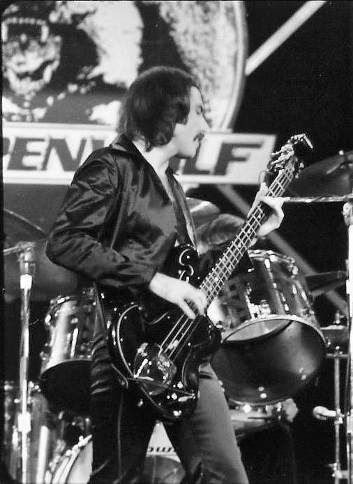 George M. Biondo playing bass on stage