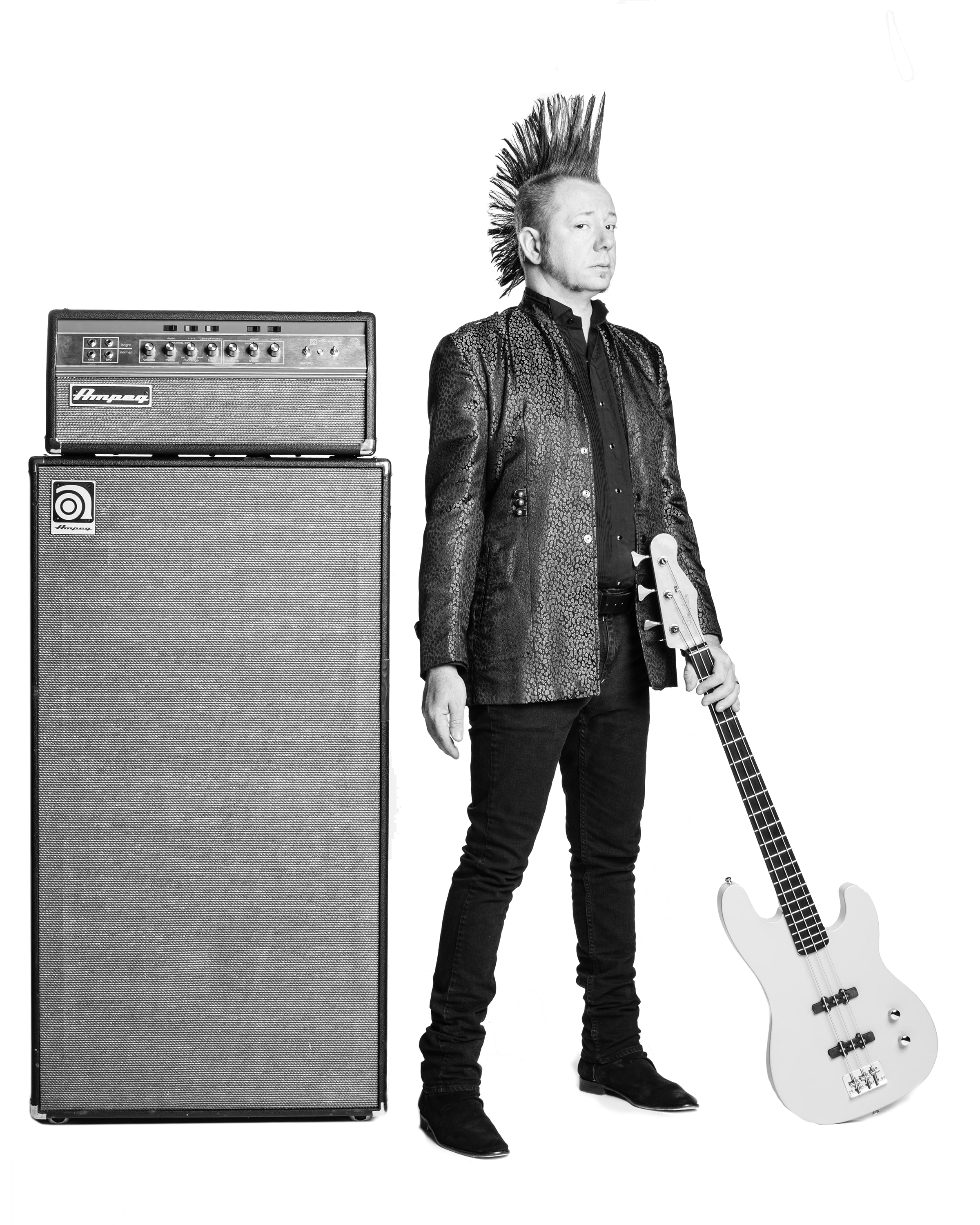 Aden Bubeck standing by an Ampeg SVT-VR stack with bass in hand