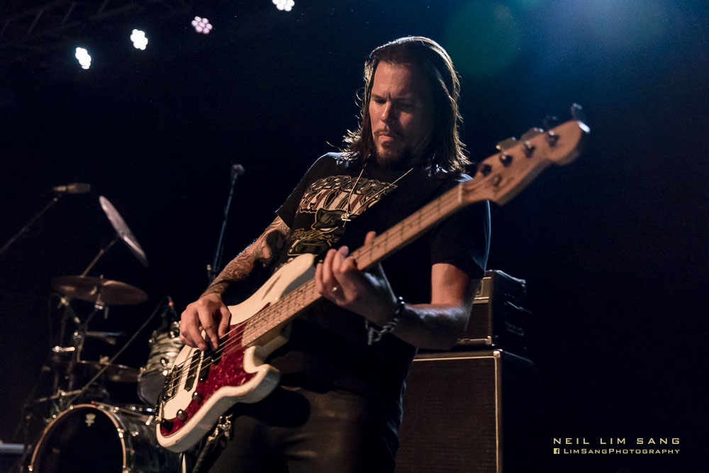 Sean McNabb playing bass on stage