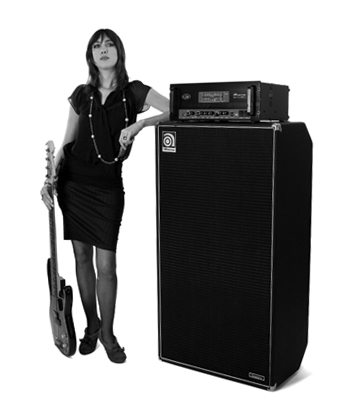 Eva Gardner leaning on a SVT-810E with her bass by her side