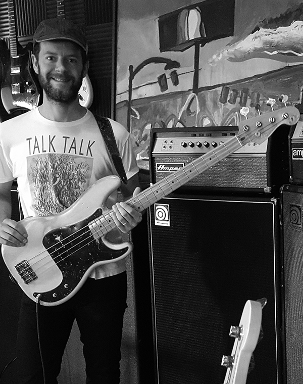 David Hartley holding a bass
