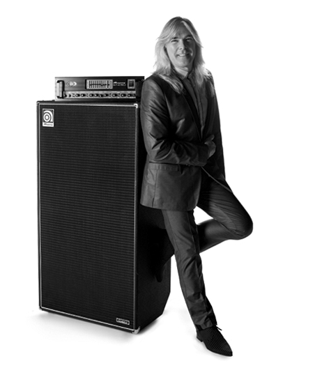 Cliff Williams leaning against an Ampeg stack