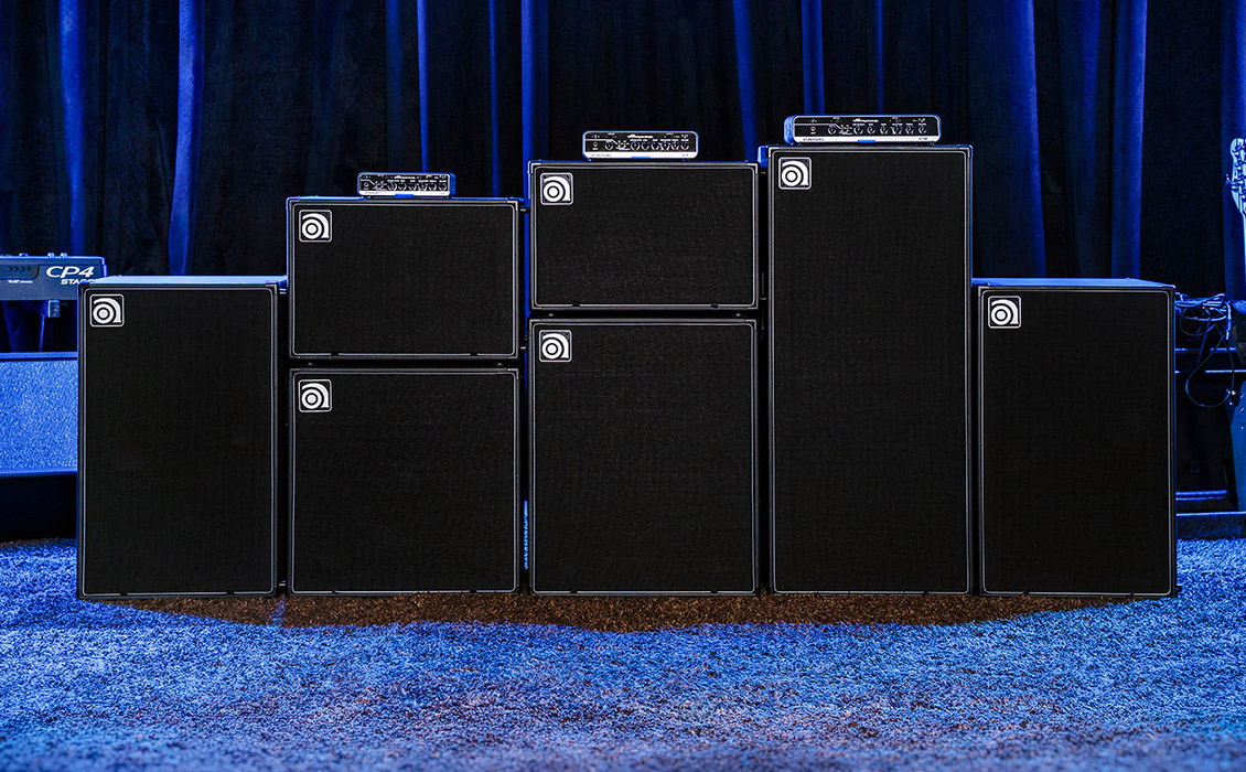 Venture V3, V7, and V12 bass amps with VB-88, VB-112, VB-115, VB-210, VB-212, and VB-410 cabs on stage.