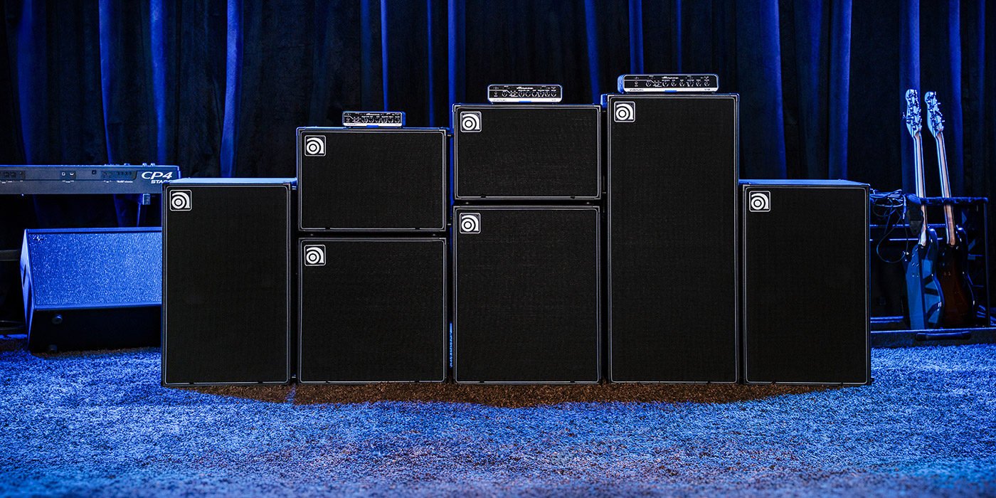 Venture V3, V7, and V12 bass amps with VB-88, VB-112, VB-115, VB-210, VB-212, and VB-410 cabs on stage.